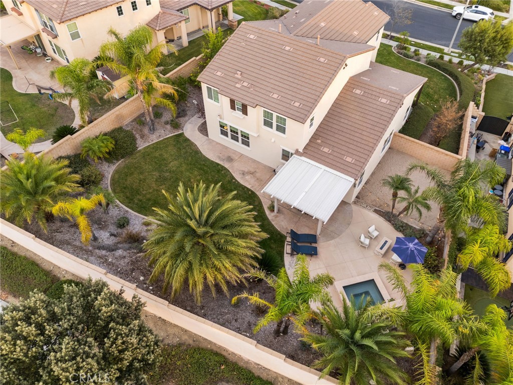 5156 Tahoe Place Rancho Cucamonga, CA 91739 - Photo 40 of 49 an aerial view of a house with a yard and potted plants