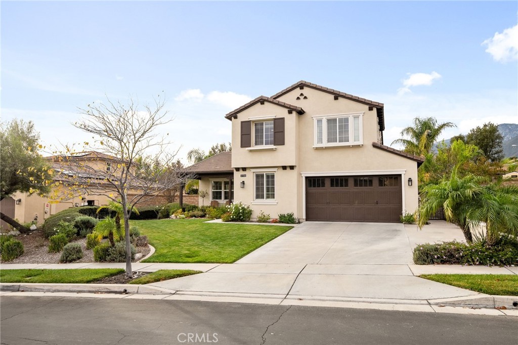 5156 Tahoe Place Rancho Cucamonga, CA 91739 - Photo 49 of 49 a front view of a house with a yard and garage