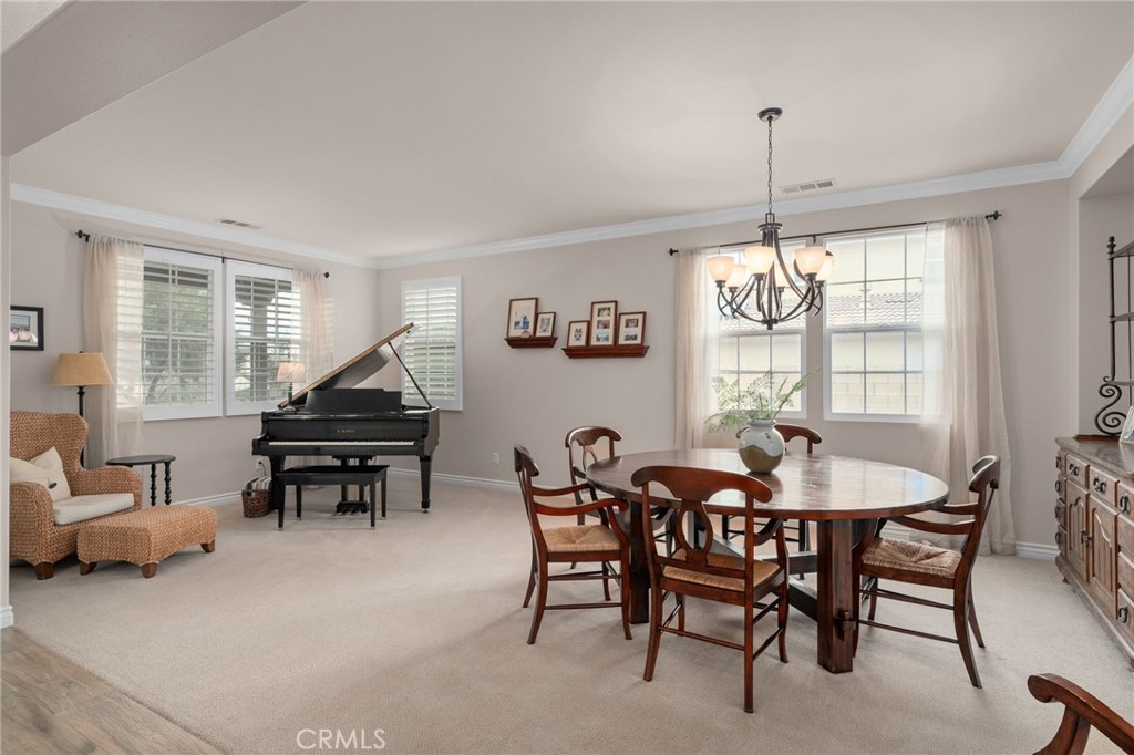 5156 Tahoe Place Rancho Cucamonga, CA 91739 - Photo 7 of 49 a dining room with furniture a chandelier and window