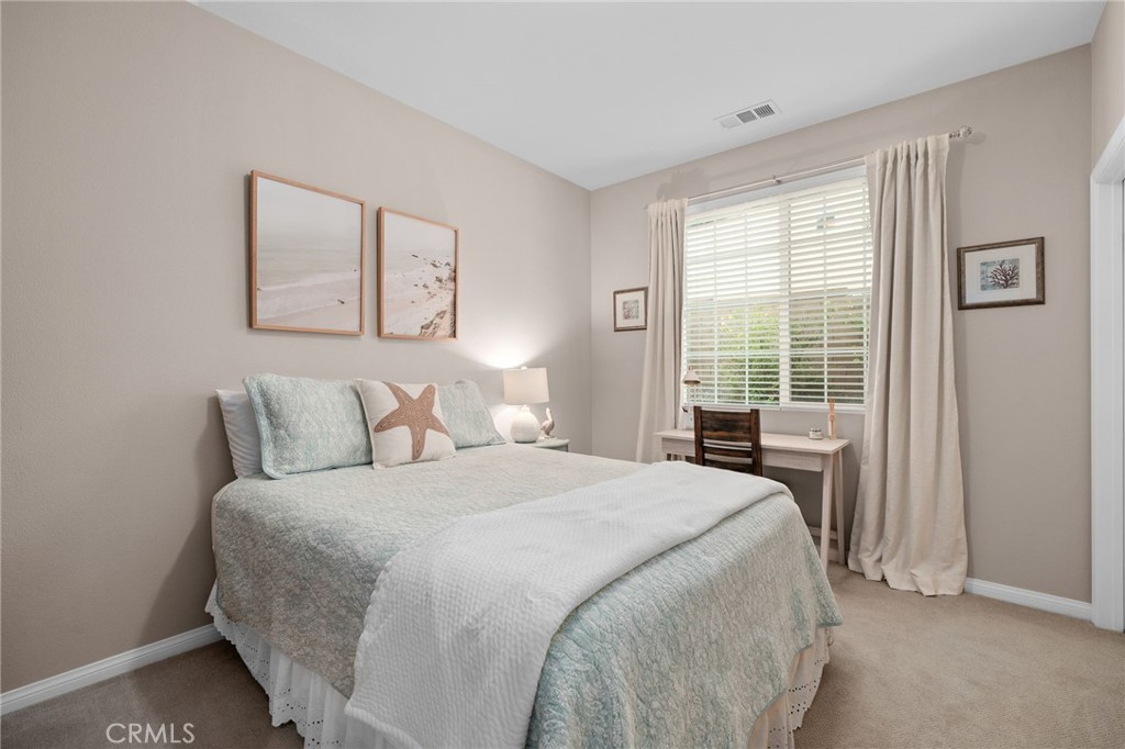 5156 Tahoe Place Rancho Cucamonga, CA 91739 - Photo 10 of 49 a bedroom with a large bed and a window