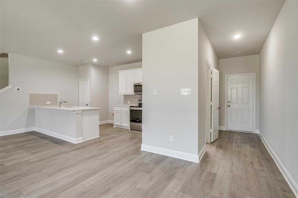 6807 Robert Reed Drive Arlington, TX 76001 - Photo 11 of 37 a view of kitchen with wooden floor