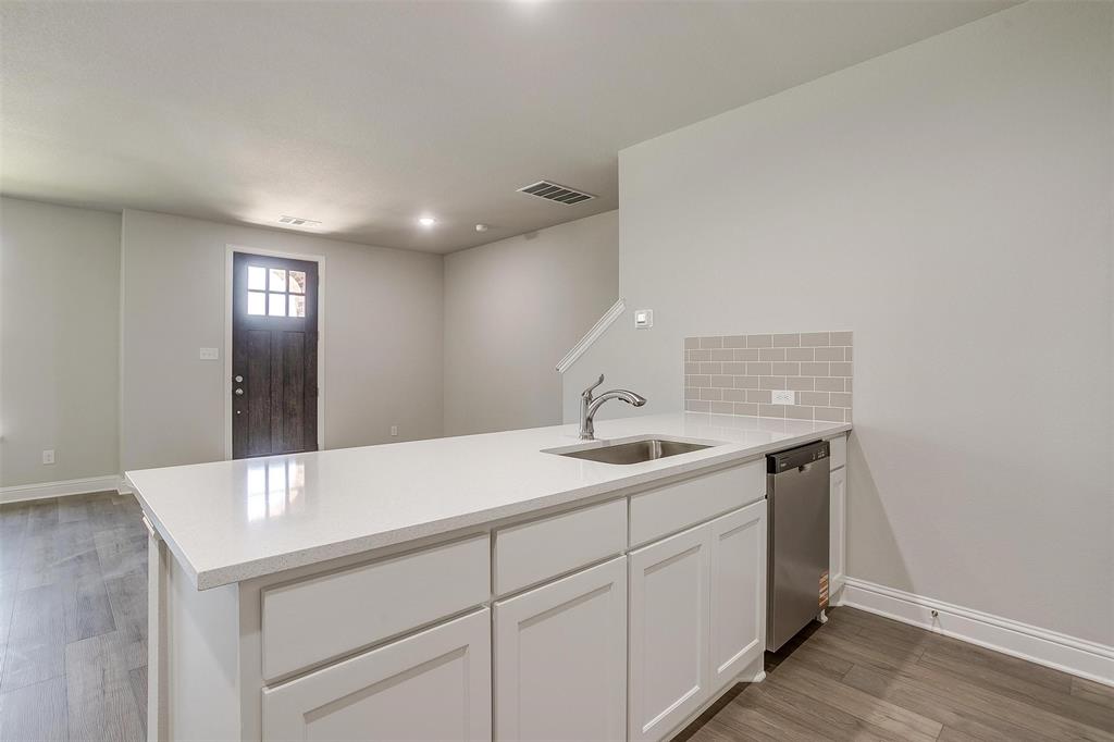 6807 Robert Reed Drive Arlington, TX 76001 - Photo 16 of 37 a bathroom with a sink and a mirror