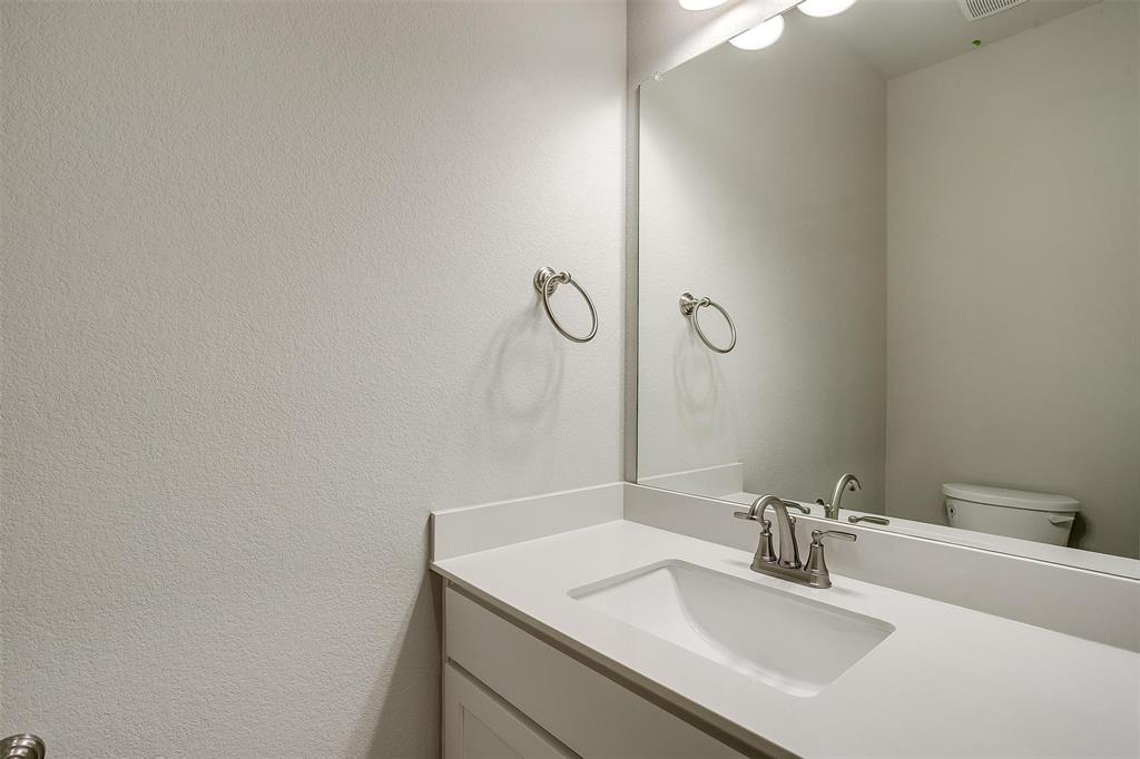 6807 Robert Reed Drive Arlington, TX 76001 - Photo 20 of 37 a bathroom with a sink and a mirror