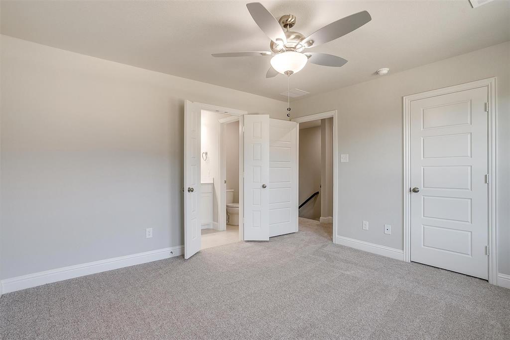 6807 Robert Reed Drive Arlington, TX 76001 - Photo 24 of 37 a view of an empty room with a ceiling fan