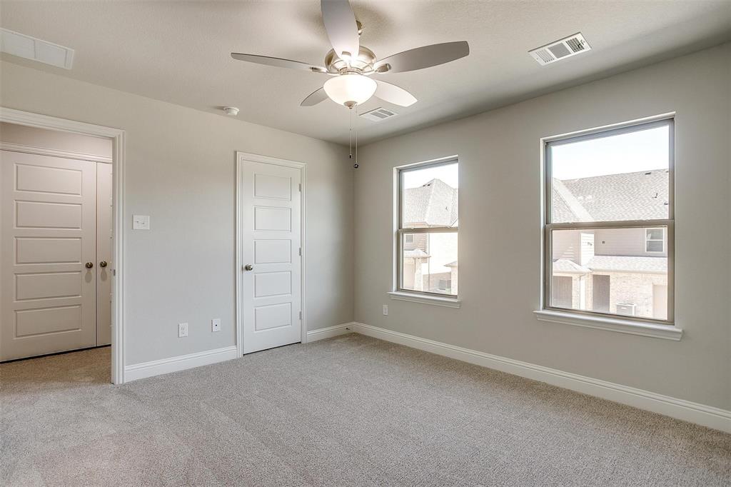 6807 Robert Reed Drive Arlington, TX 76001 - Photo 25 of 37 an empty room with windows and ceiling fan