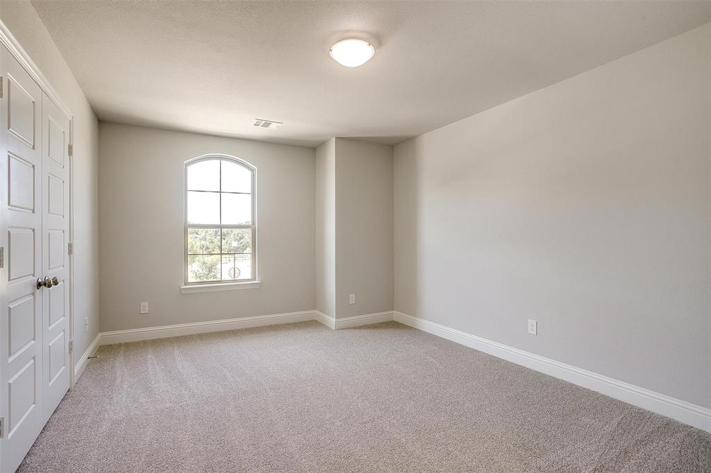 6807 Robert Reed Drive Arlington, TX 76001 - Photo 28 of 37 an empty room with a empty space and windows