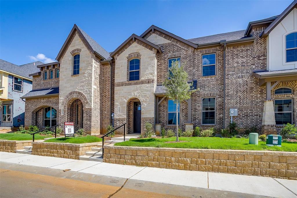 6807 Robert Reed Drive Arlington, TX 76001 - Photo 3 of 37 a front view of a house with a garden and plants
