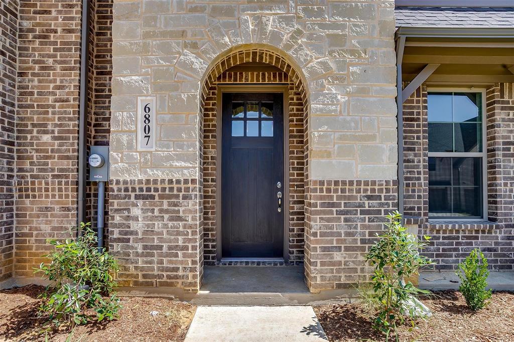 6807 Robert Reed Drive Arlington, TX 76001 - Photo 4 of 37 a building with a door