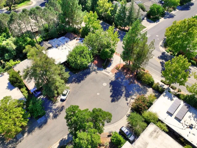 an aerial view of a house with a lot of flower plants