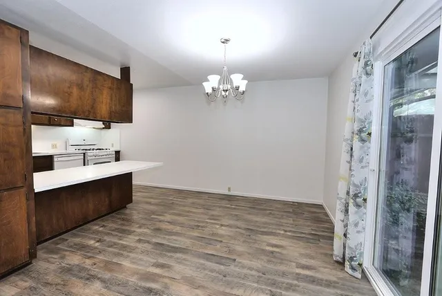 a spacious bathroom with a double vanity sink a mirror and a shower