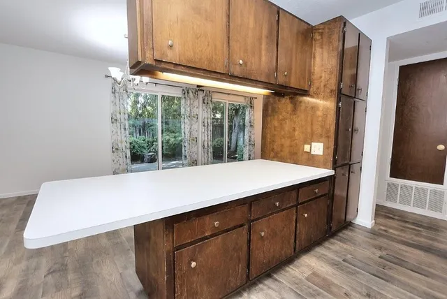 a room with a sink and a large window