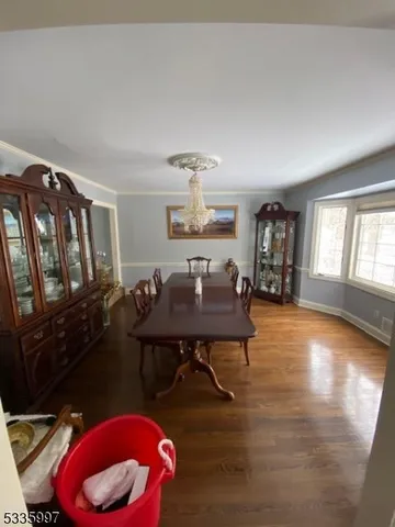 a living room with furniture a rug and a window