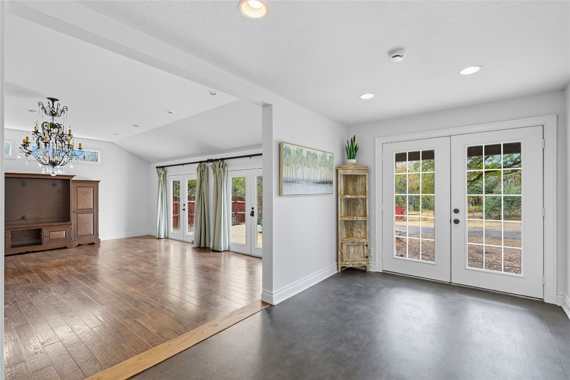 3003 Burleson Road Austin, TX 78741 - Photo 12 of 35 a view of an empty room with a window and wooden floor