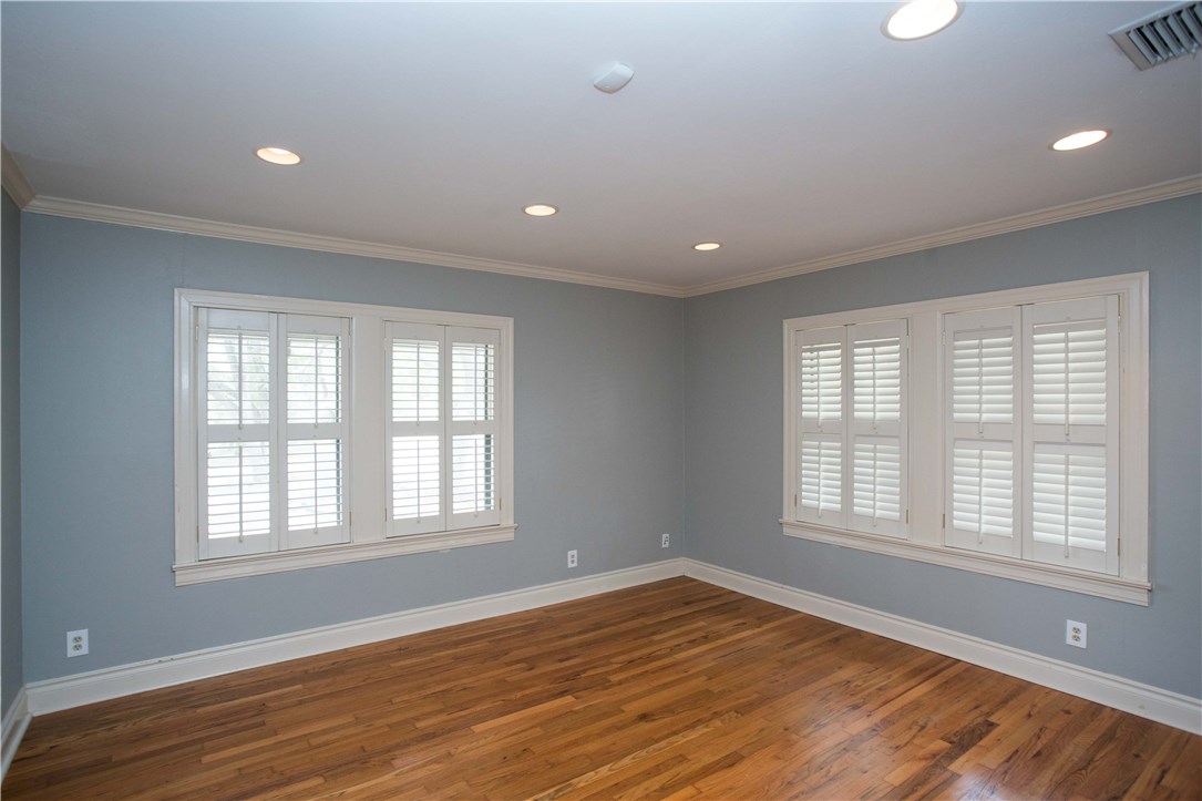 3003 Burleson Road Austin, TX 78741 - Photo 16 of 35 a view of an empty room with wooden floor and a window