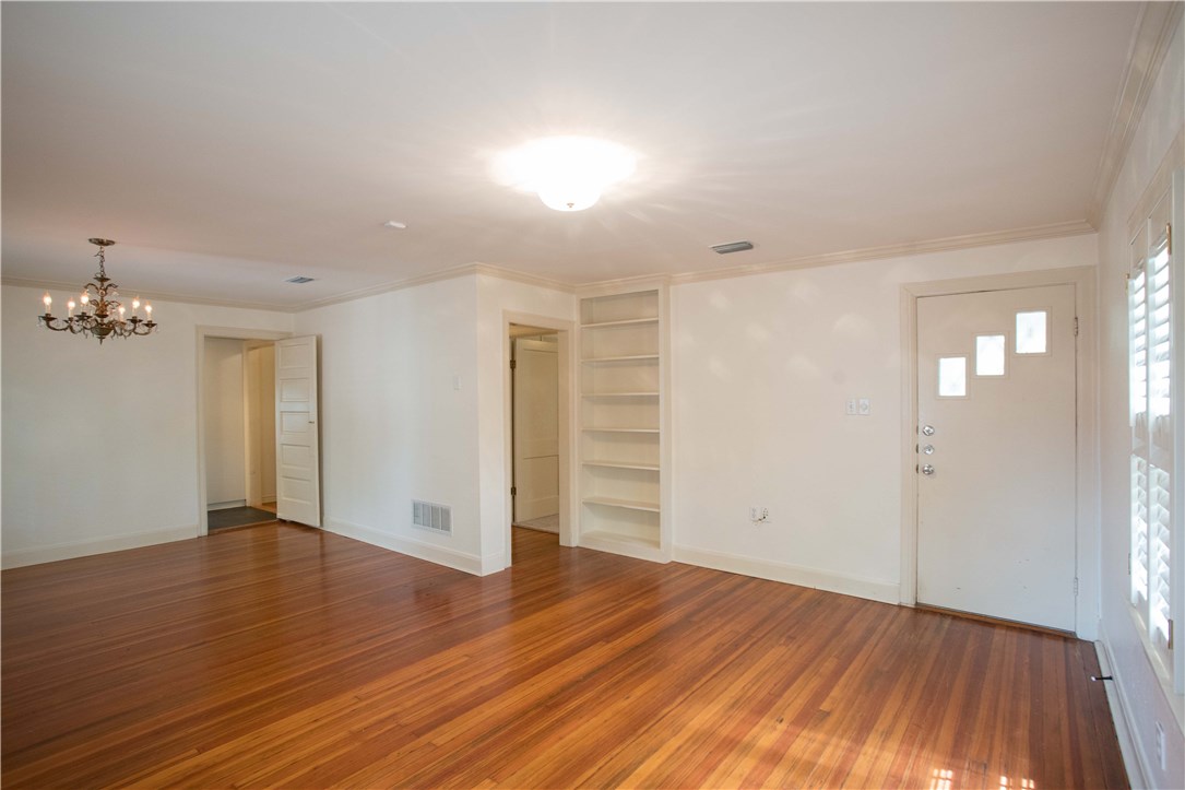 3003 Burleson Road Austin, TX 78741 - Photo 19 of 35 wooden floor in an empty room with a window