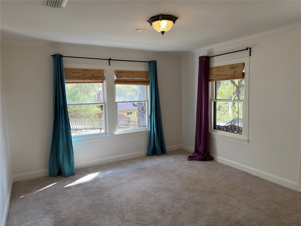 3003 Burleson Road Austin, TX 78741 - Photo 21 of 35 an empty room with windows and closet