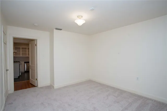 a view of a patio with table and chairs and wooden floor
