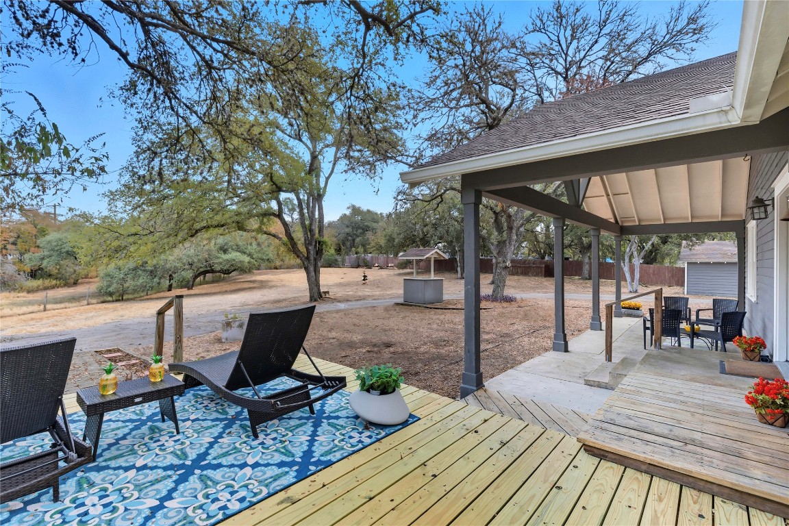 3003 Burleson Road Austin, TX 78741 - Photo 28 of 35 a view of a patio with table and chairs and wooden floor