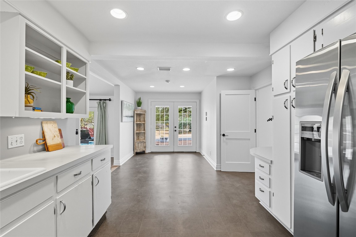 3003 Burleson Road Austin, TX 78741 - Photo 10 of 35 a kitchen with stainless steel appliances a refrigerator sink and cabinets