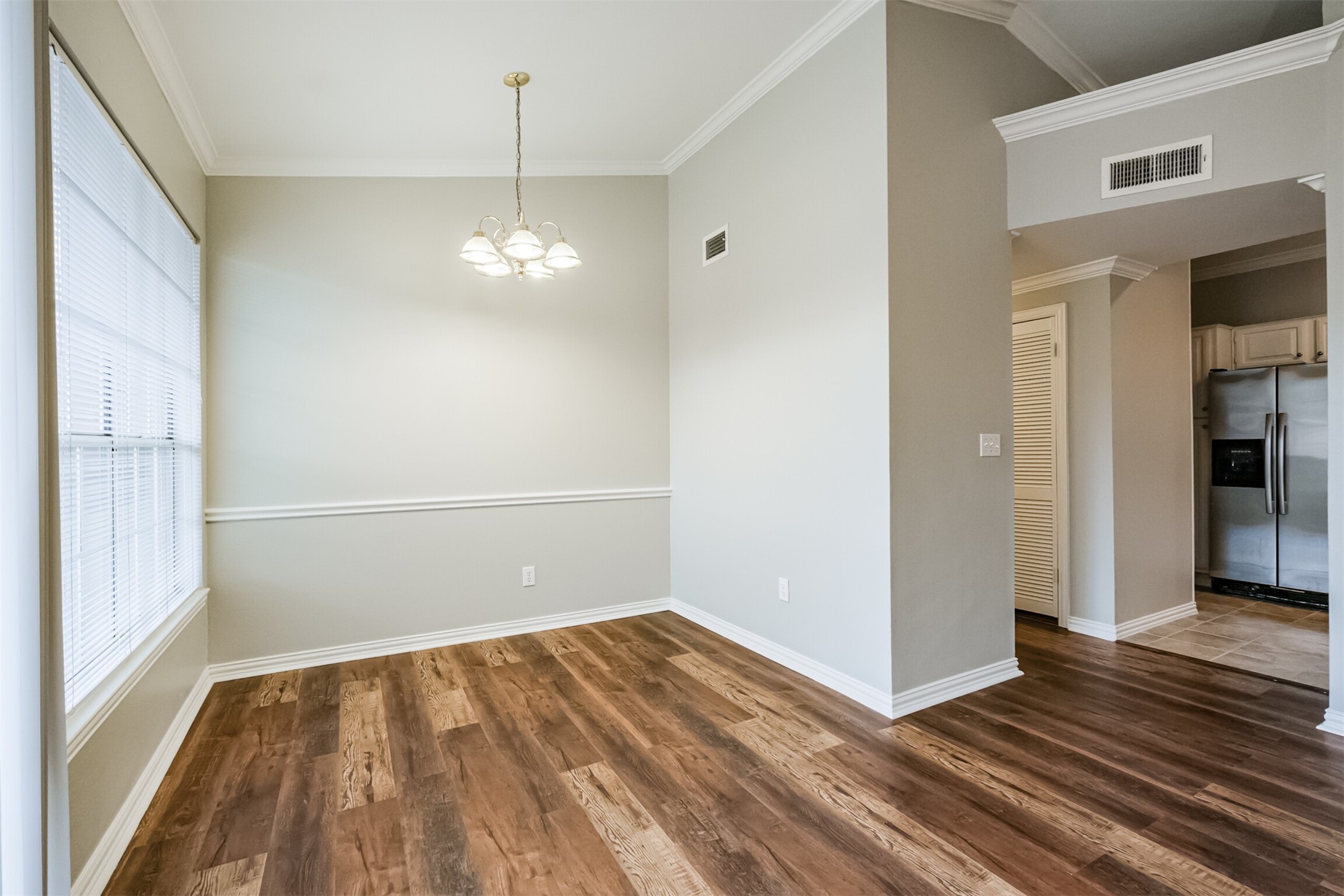 2111 Welch Street, Unit B304 Houston, TX 77019 - Photo 7 of 37 a view of a room with wooden floor and a window