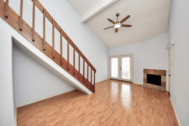a view of an entryway with wooden floor