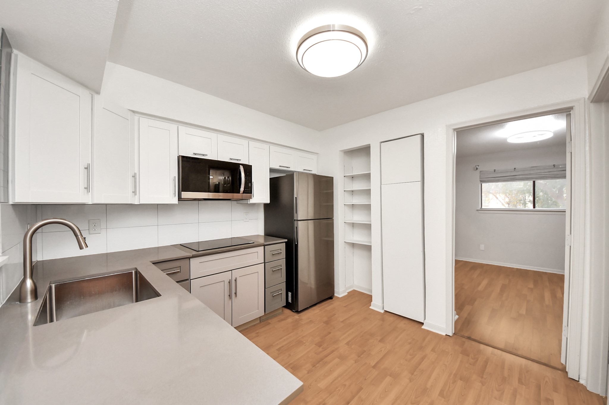 2425 Holly Hall Street, Unit C54 Houston, TX 77054 - Photo 6 of 24 a kitchen with stainless steel appliances granite countertop a refrigerator and a stove top oven