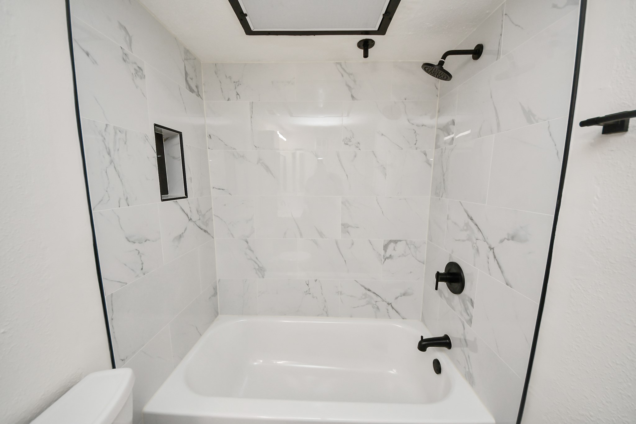 2425 Holly Hall Street, Unit C54 Houston, TX 77054 - Photo 10 of 24 a bathroom with a bathtub