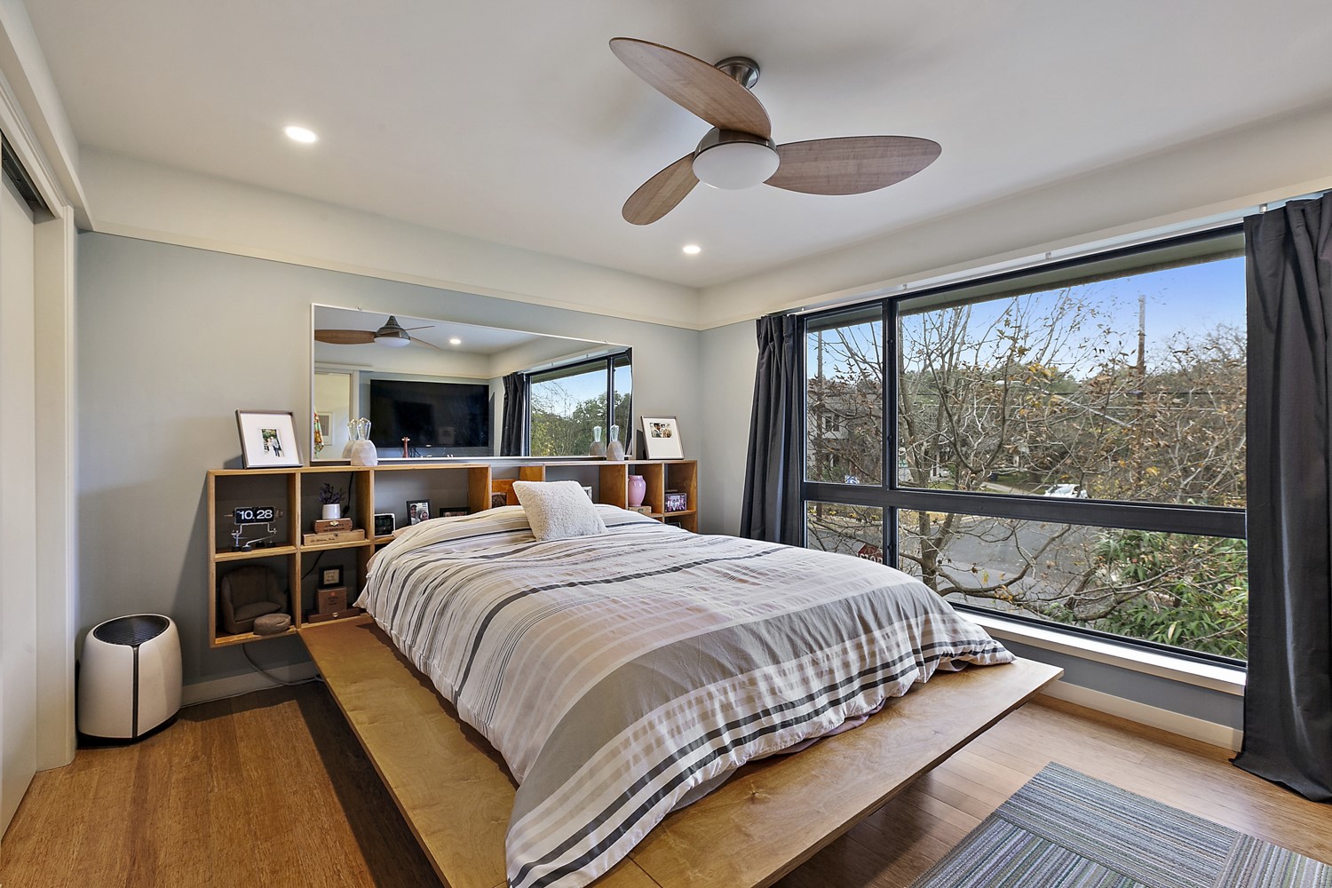 805 Cumberland Road, Unit B Austin, TX 78704 - Photo 22 of 37 a bedroom with a large bed and a large window