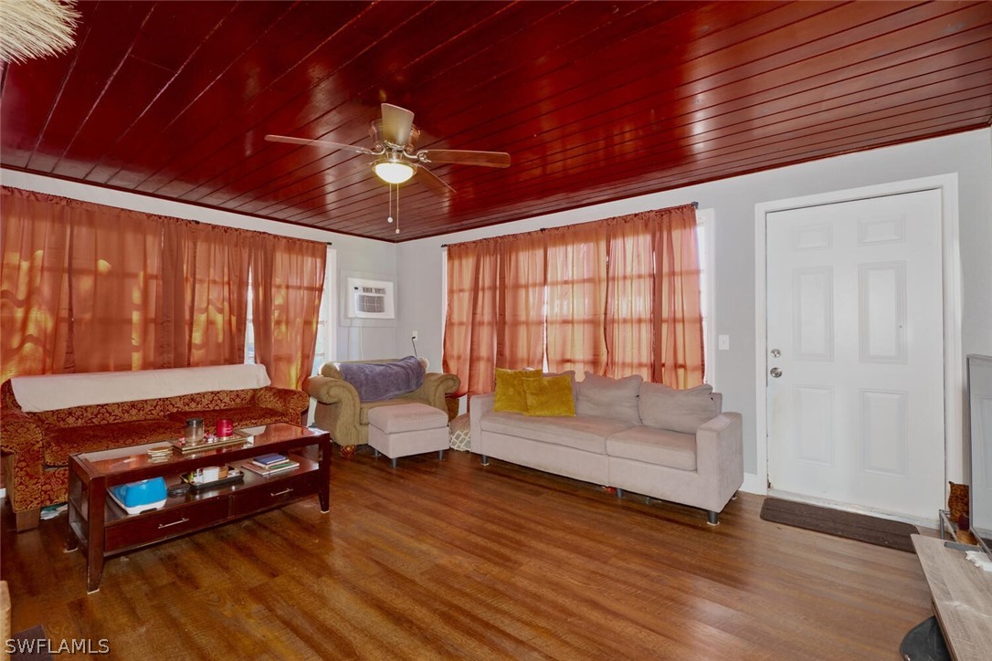 1322 Old Bridge Road North Fort Myers, FL 33917 - Photo 2 of 15 a living room with furniture lamps and wooden floor