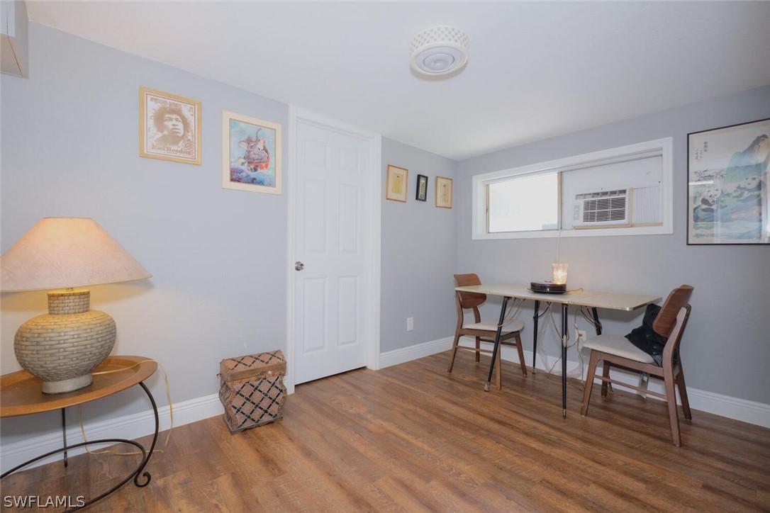 1322 Old Bridge Road North Fort Myers, FL 33917 - Photo 3 of 15 a workspace with furniture and wooden floor