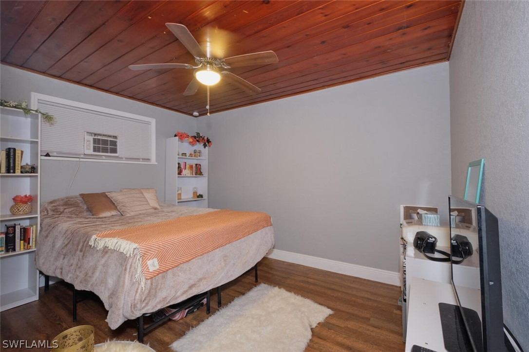 1322 Old Bridge Road North Fort Myers, FL 33917 - Photo 6 of 15 a bedroom with a bed and a chandelier