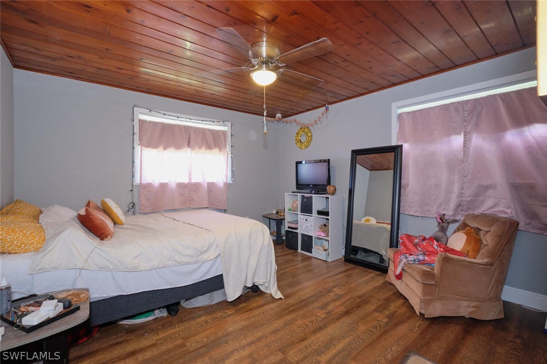 1322 Old Bridge Road North Fort Myers, FL 33917 - Photo 7 of 15 a bedroom with furniture and a wooden floor
