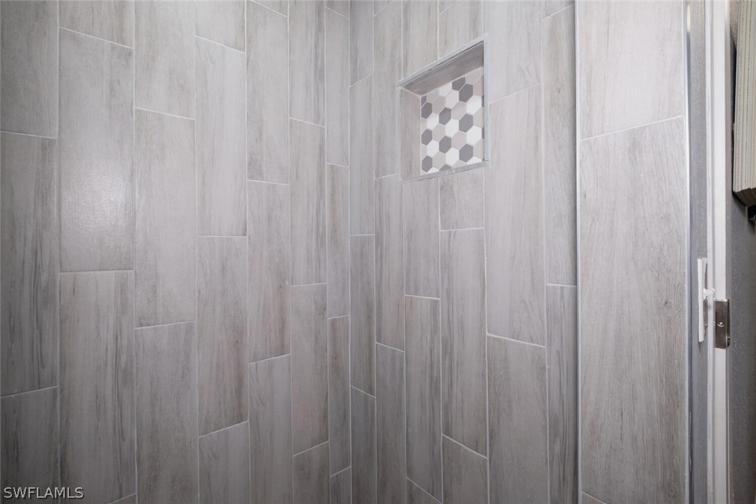 1322 Old Bridge Road North Fort Myers, FL 33917 - Photo 9 of 15 a view of a bathroom with shower curtain