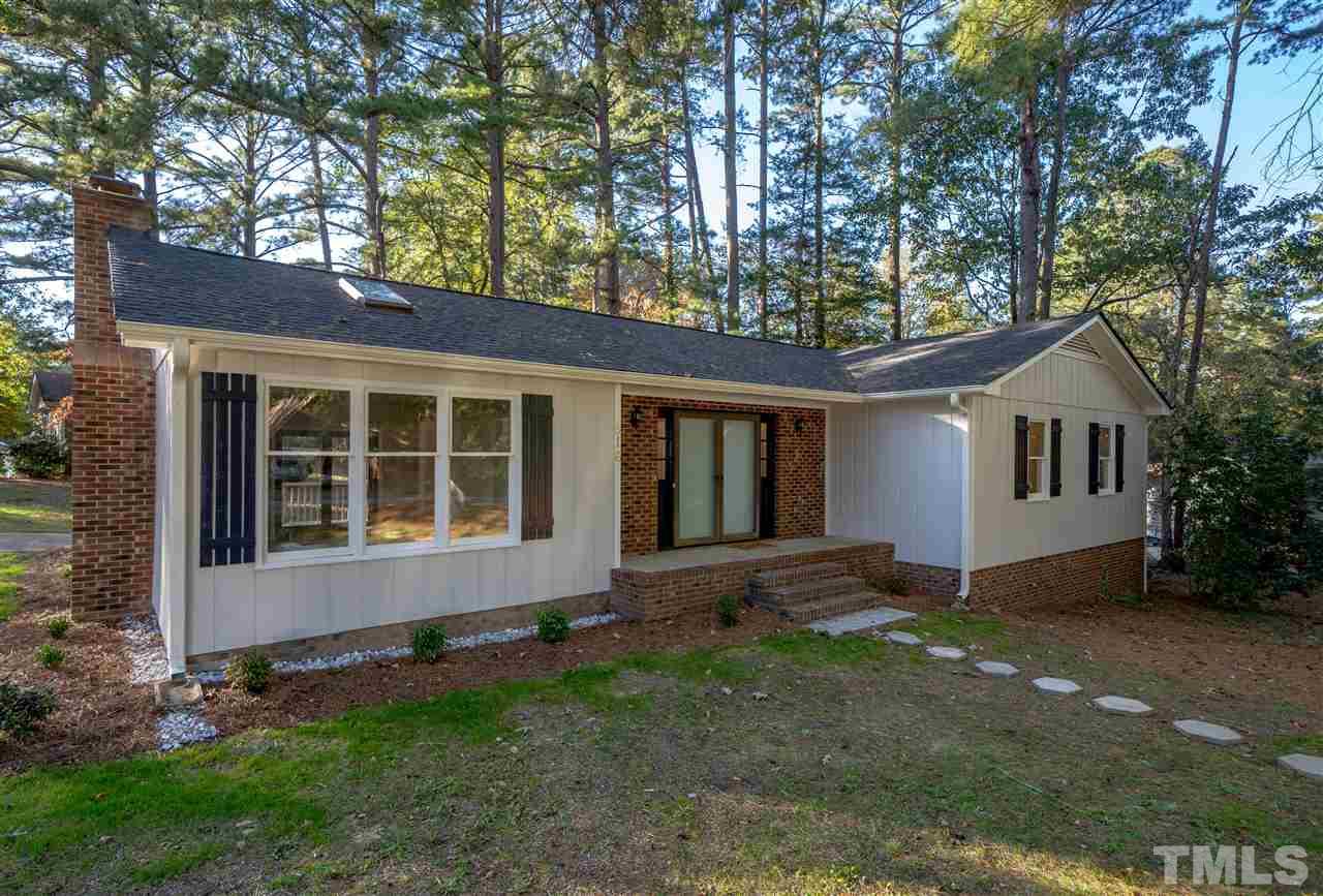 516 Merrie Road Raleigh, NC 27606 - Photo 1 of 29 a front view of a house with a yard and garage