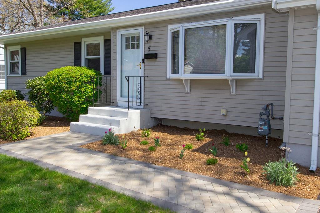 5 Patony Road Framingham, MA 01701 - Photo 3 of 22 a backyard of a house with outdoor seating