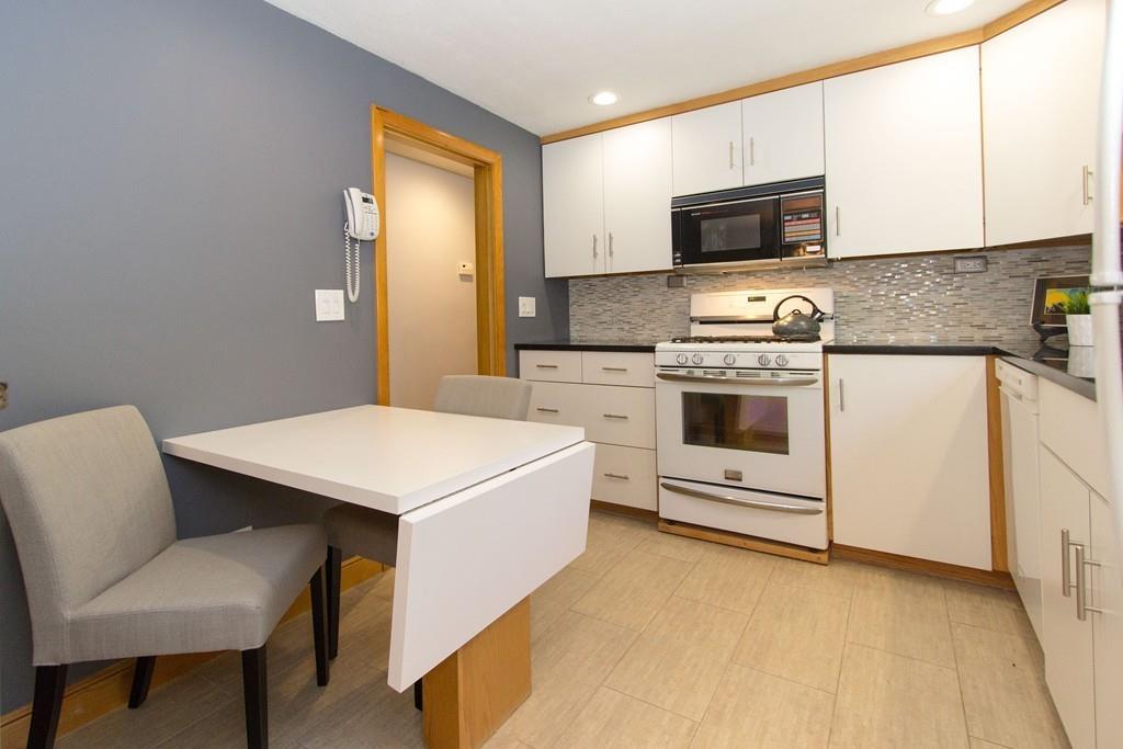 5 Patony Road Framingham, MA 01701 - Photo 7 of 22 a kitchen with a stove a sink and a microwave