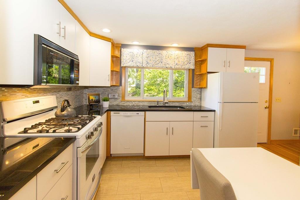 5 Patony Road Framingham, MA 01701 - Photo 8 of 22 a kitchen with a stove a sink and a refrigerator