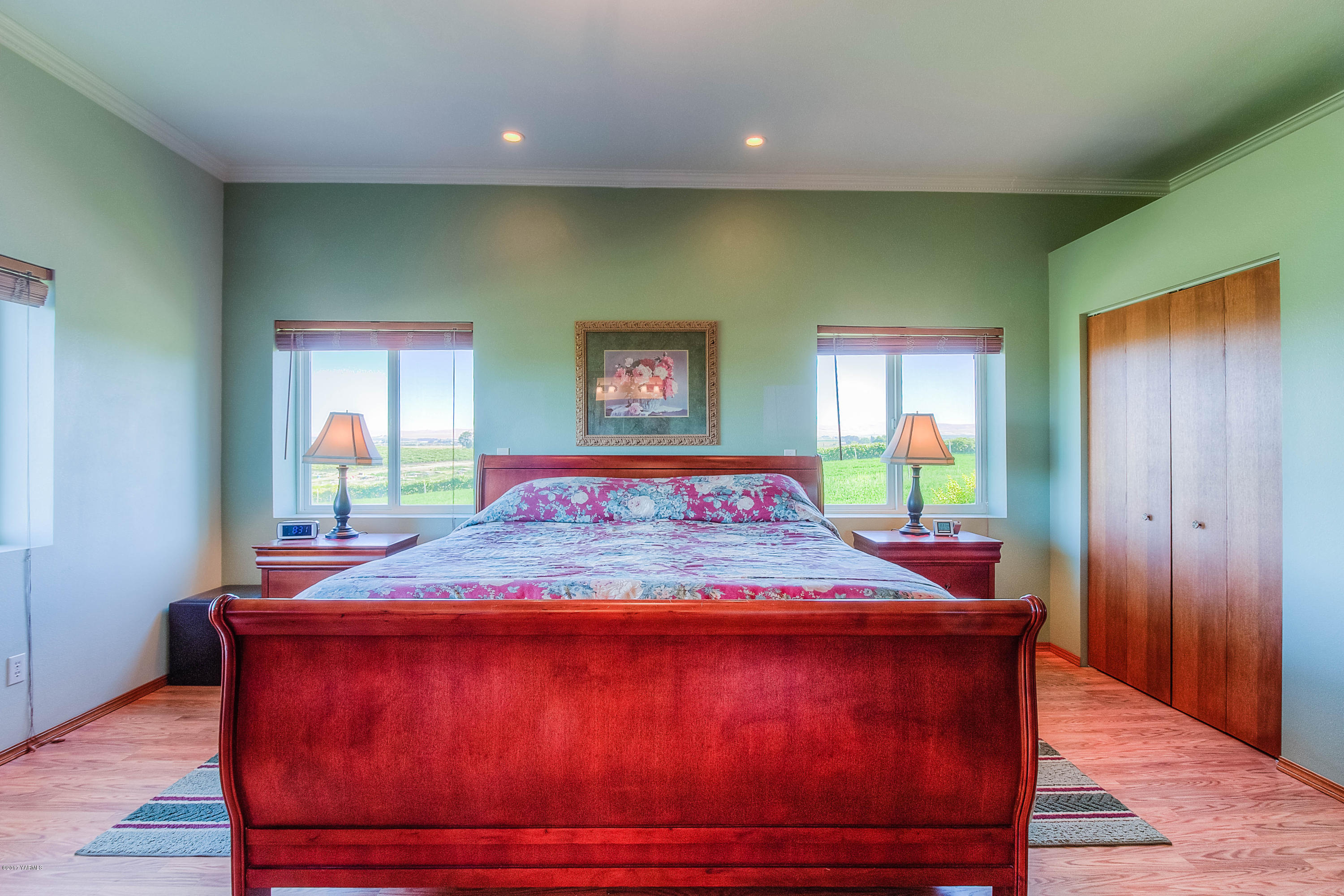 765 Lowry Road Outlook, WA 98938 - Photo 14 of 31 a room with a bed and wooden floor