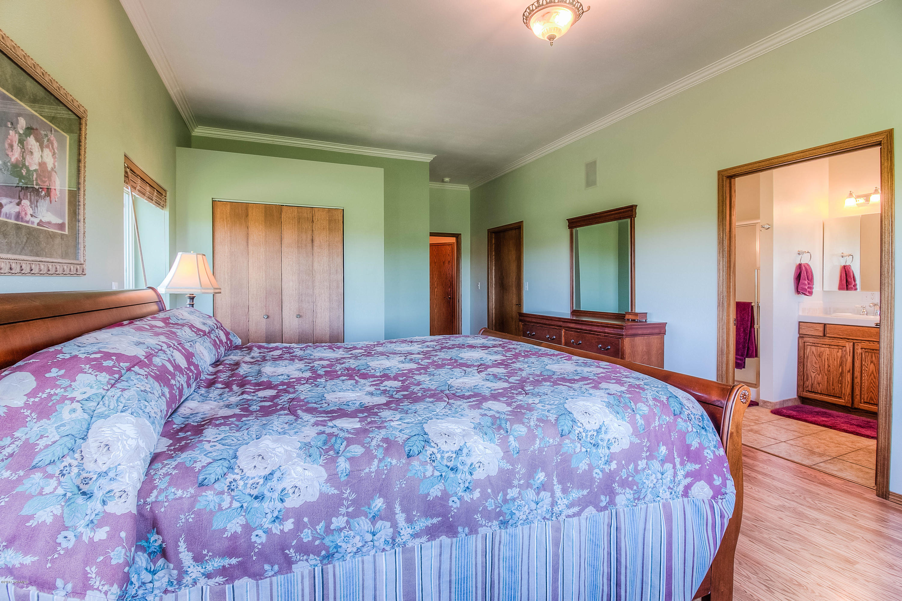 765 Lowry Road Outlook, WA 98938 - Photo 15 of 31 a bed sitting in a spacious bedroom next to a window