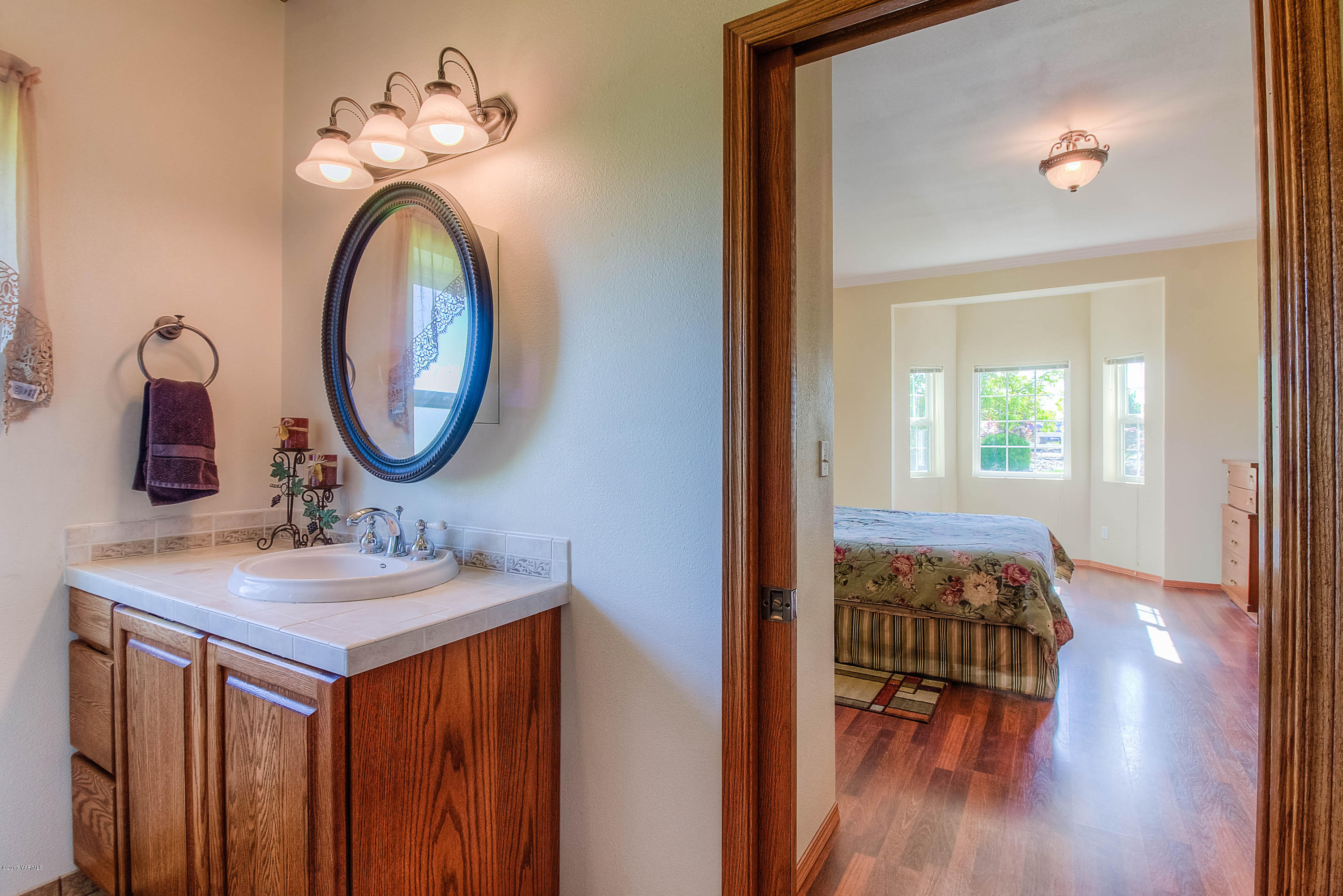 765 Lowry Road Outlook, WA 98938 - Photo 21 of 31 a bathroom with a sink and a mirror