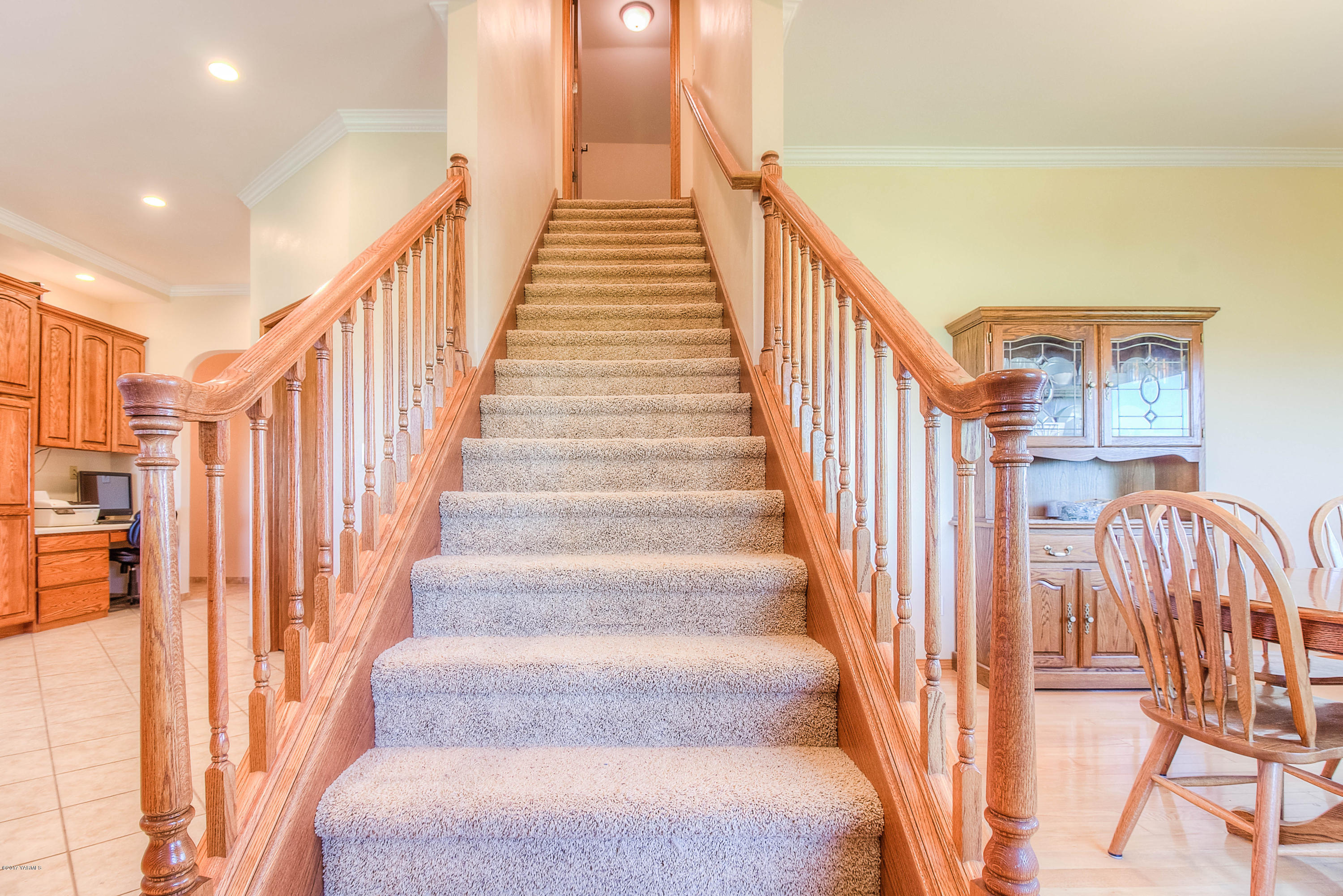 765 Lowry Road Outlook, WA 98938 - Photo 23 of 31 a view of staircase with lots of frames on wall and a large window