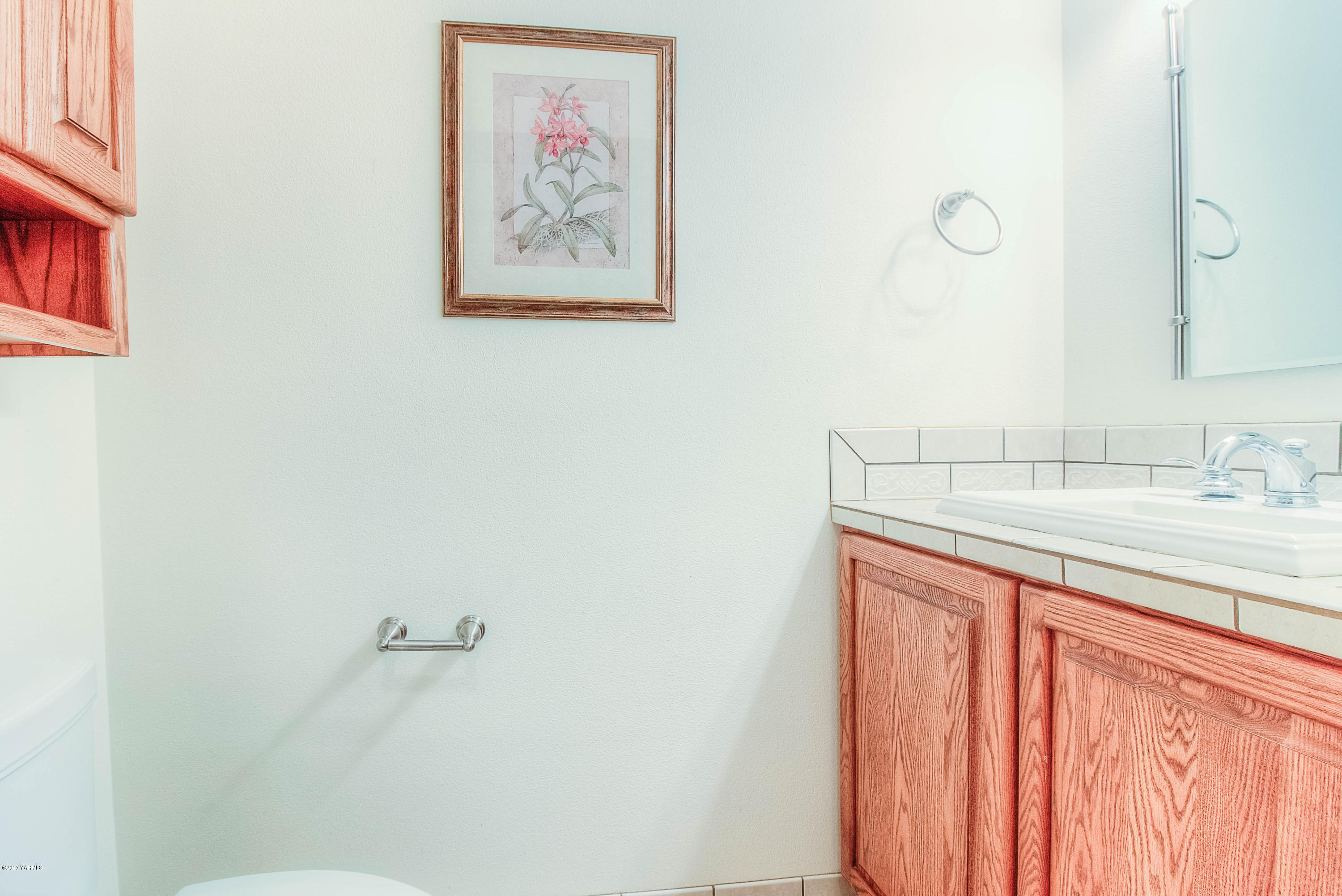 765 Lowry Road Outlook, WA 98938 - Photo 28 of 31 a bathroom with a sink and a mirror