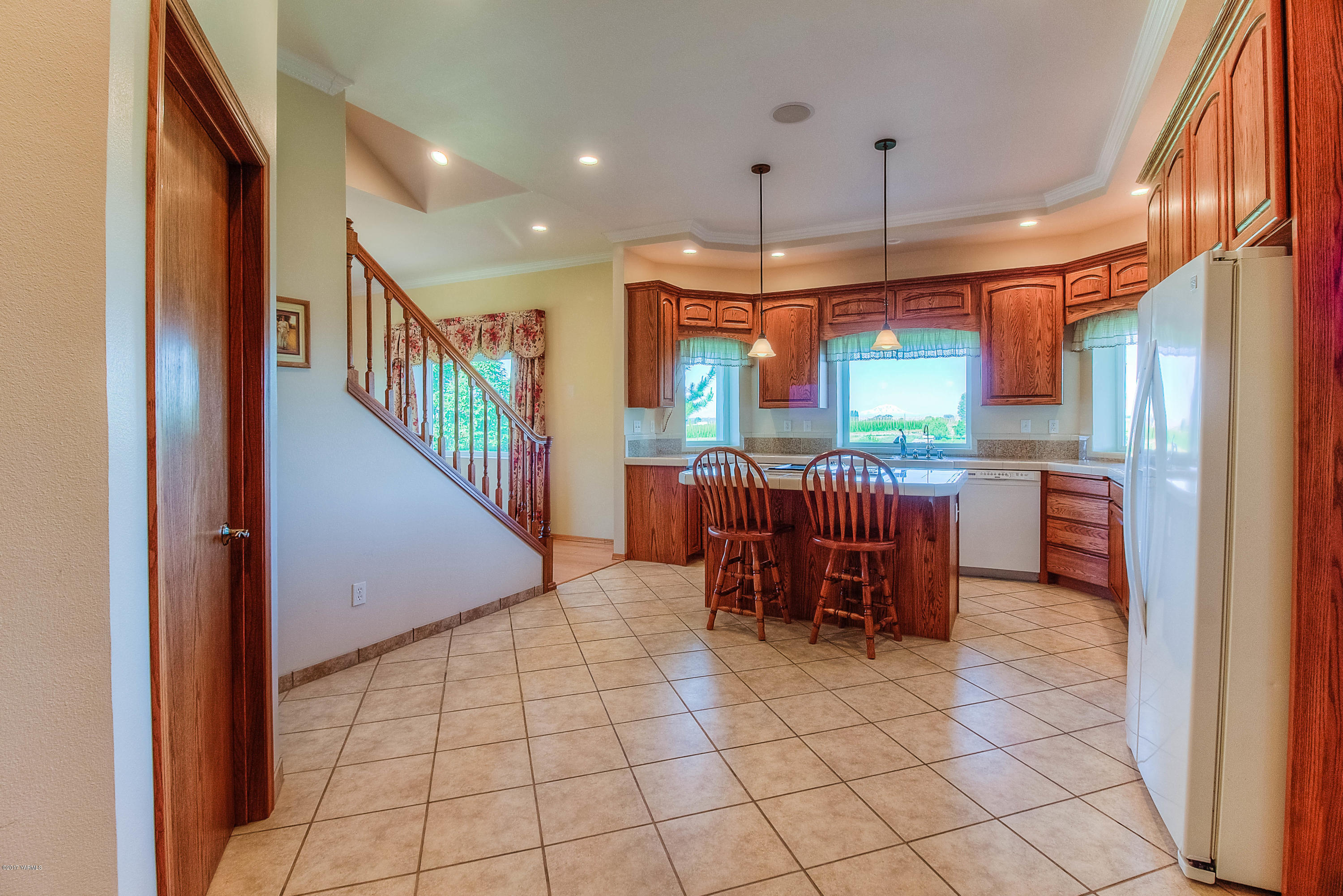 765 Lowry Road Outlook, WA 98938 - Photo 6 of 31 a kitchen with stainless steel appliances kitchen island granite countertop a refrigerator and a sink