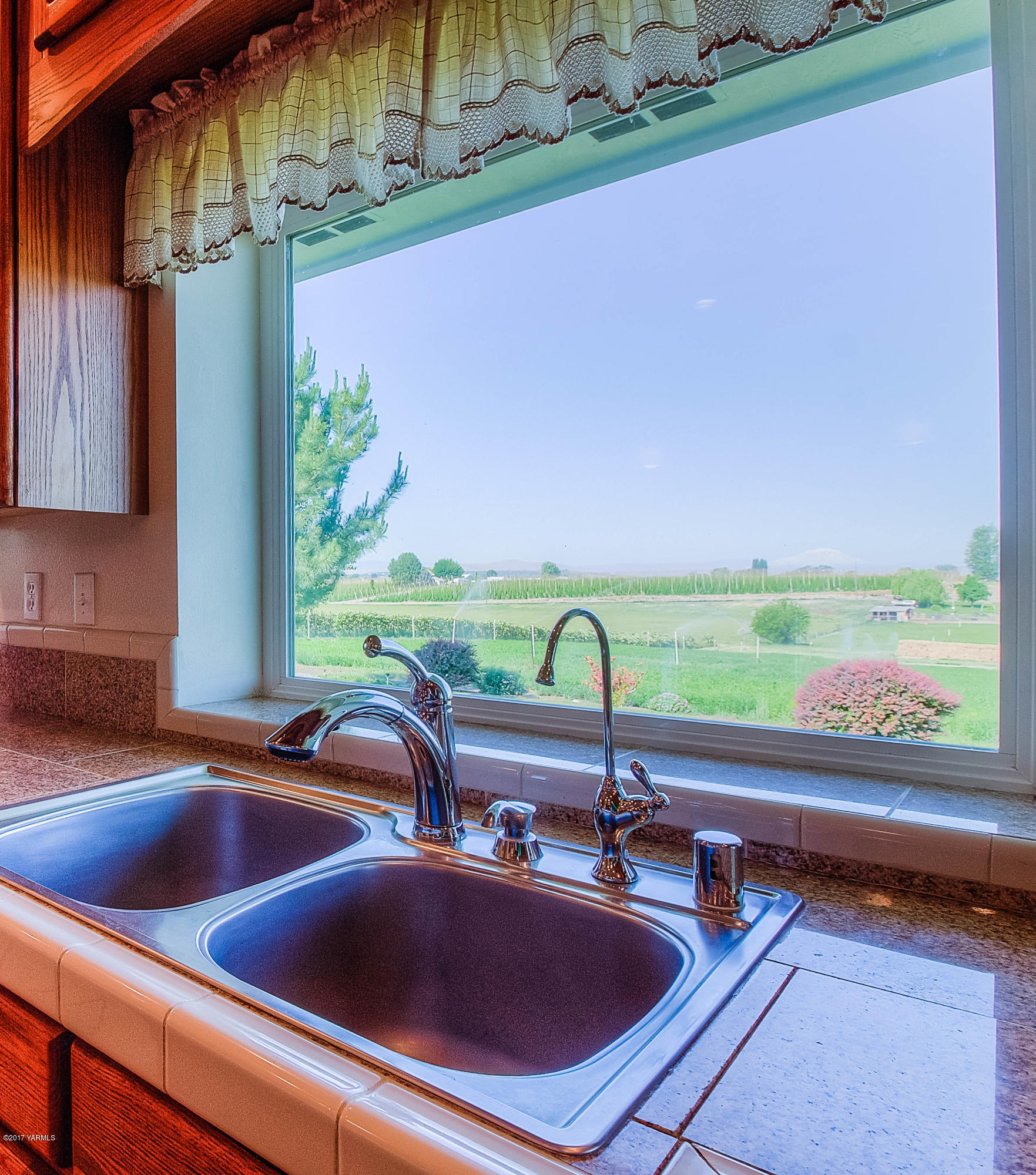 765 Lowry Road Outlook, WA 98938 - Photo 8 of 31 a kitchen with a sink and a large window