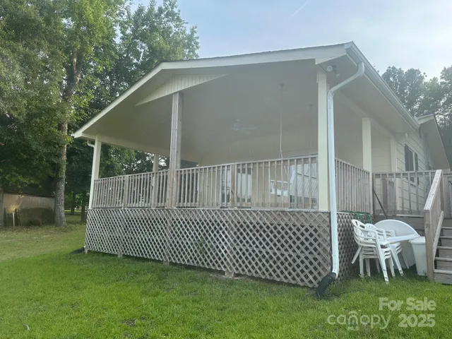 a view of a deck with a yard