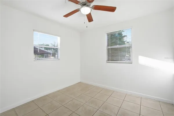 a view of an empty room with a window