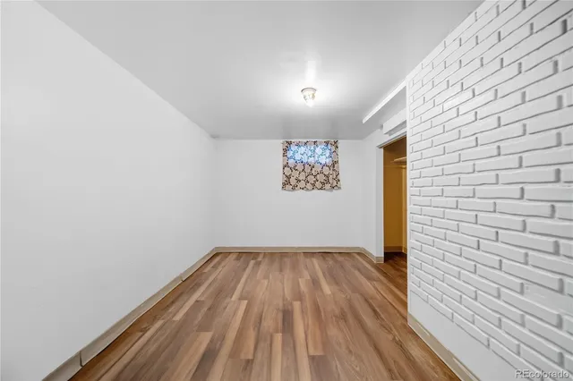 a view of wooden floor in an empty room