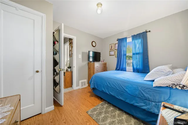 a bedroom with a bed and a dresser