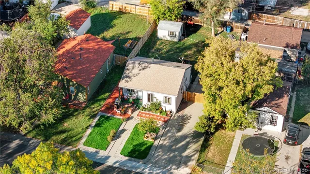an aerial view of a house with a yard and garden