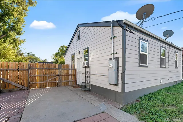 a side view of a house with a garage
